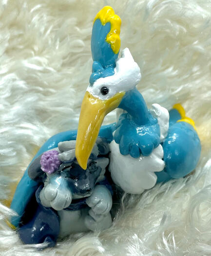 A cramorant comforts a crying sprigatito